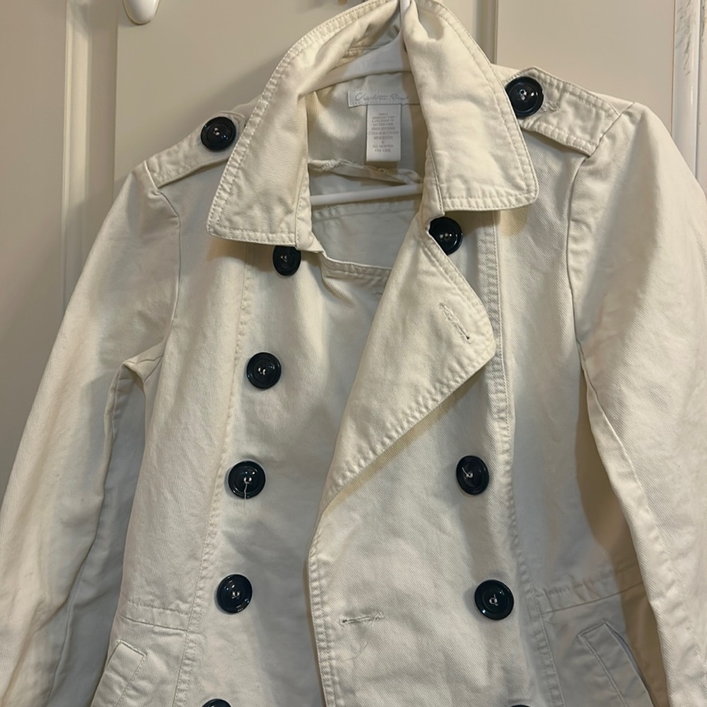 Women’s size small Charlotte Russe white jacket with front pockets.